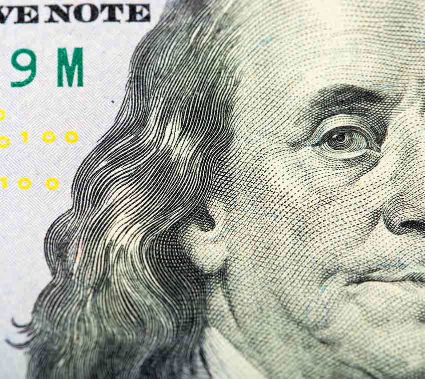 Closeup of Ben Franklin's face on dollar bill